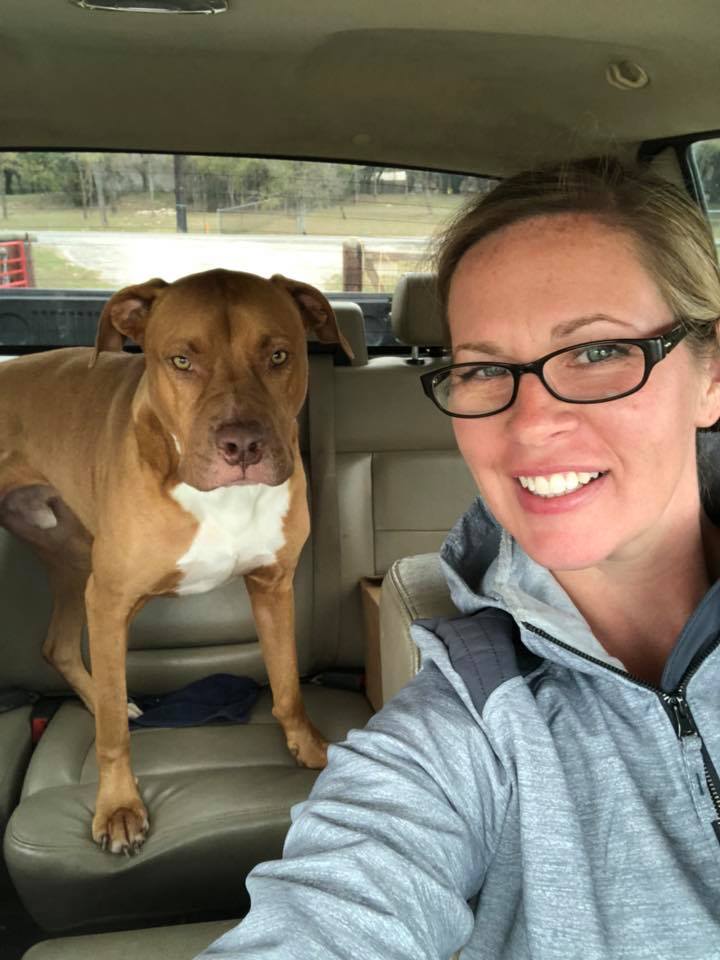 Lisa in car with pup
